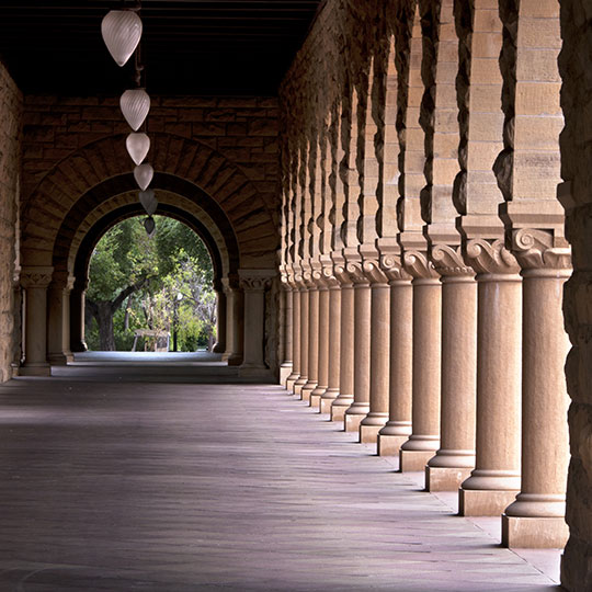 Exterior of building corridor with long row of columns
