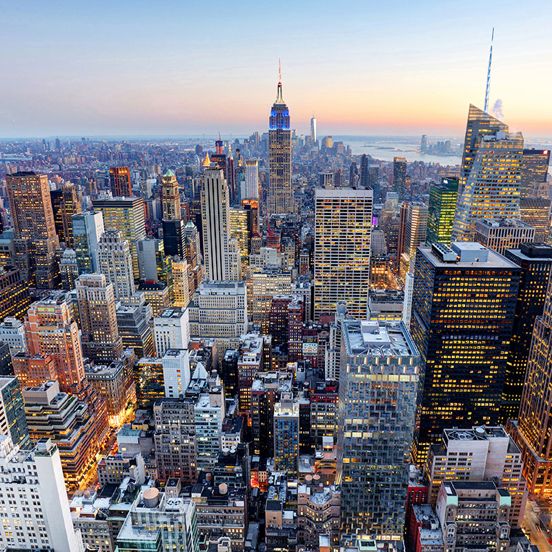 Ariel view of lit up cityscape and streets