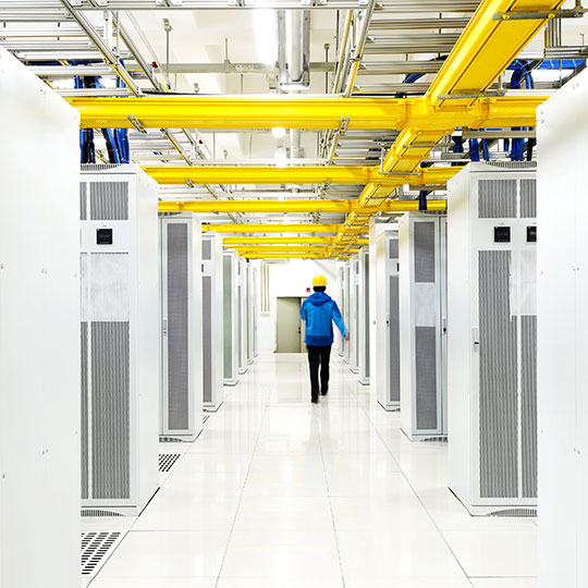 Interior of telco room with machinery lined up