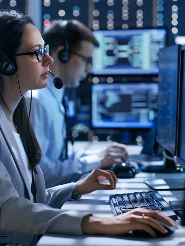 Woman with headset working on computer