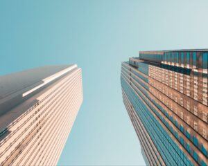 2 high-rise buildings facing each other during the daytime.